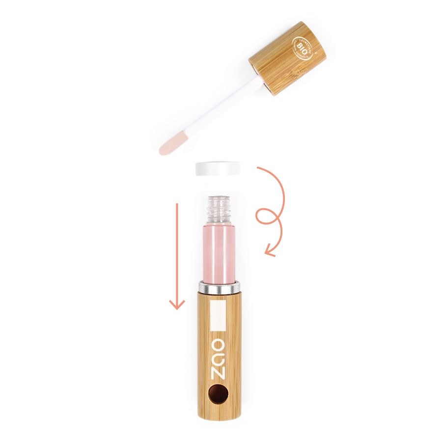 Bambusbehälter mit geöffnetem Deckel und Applikator. Der Behälter enthält eine rosa Flüssigkeit. Pfeile zeigen die Anwendung.