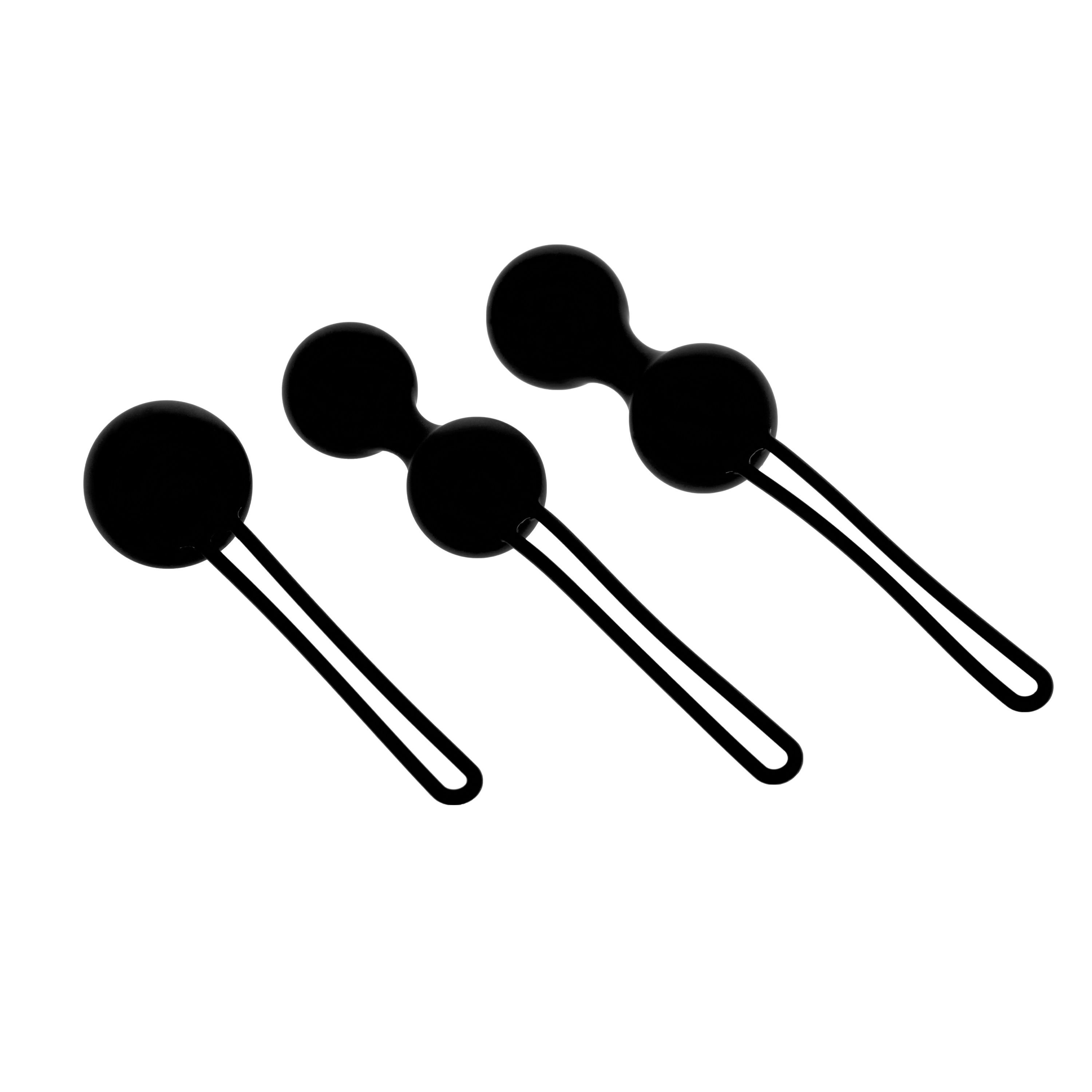 Drei schwarze Kugeln mit Schlaufen. Zwei Kugeln sind verbunden. Alle haben eine runde Form.