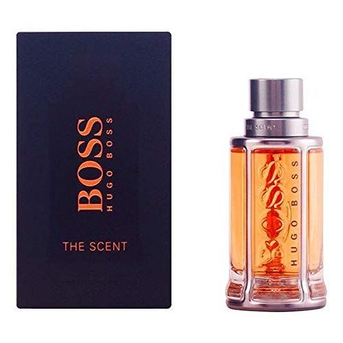 Hugo Boss The Scent Eau de Toilette Flakon neben schwarzer Box.
