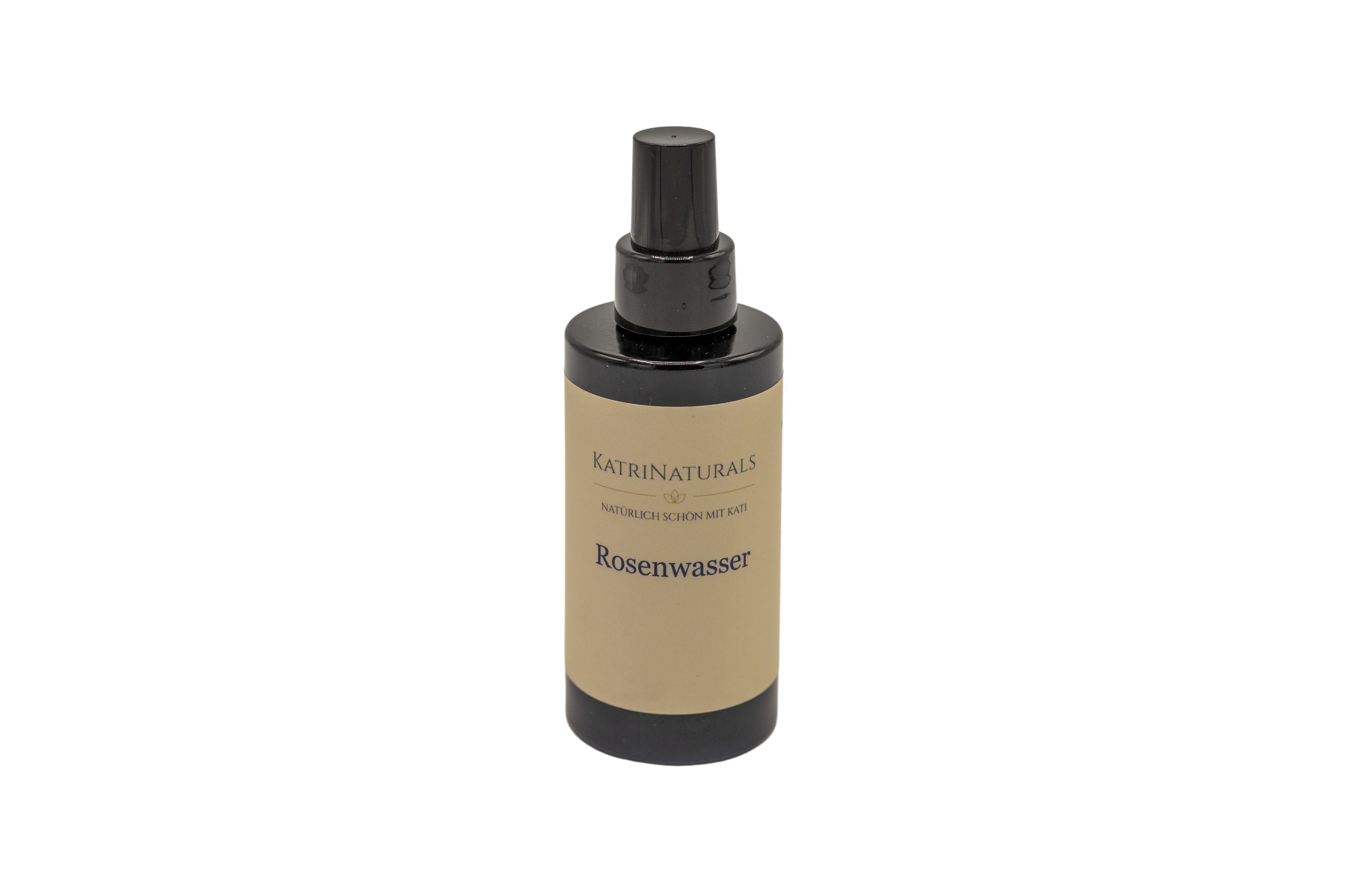 KatriNaturals Rosenwasser-Sprühflasche. Schwarzer Sprühkopf und -basis, braunes Etikett mit Text. Aufschrift: Rosenwasser.