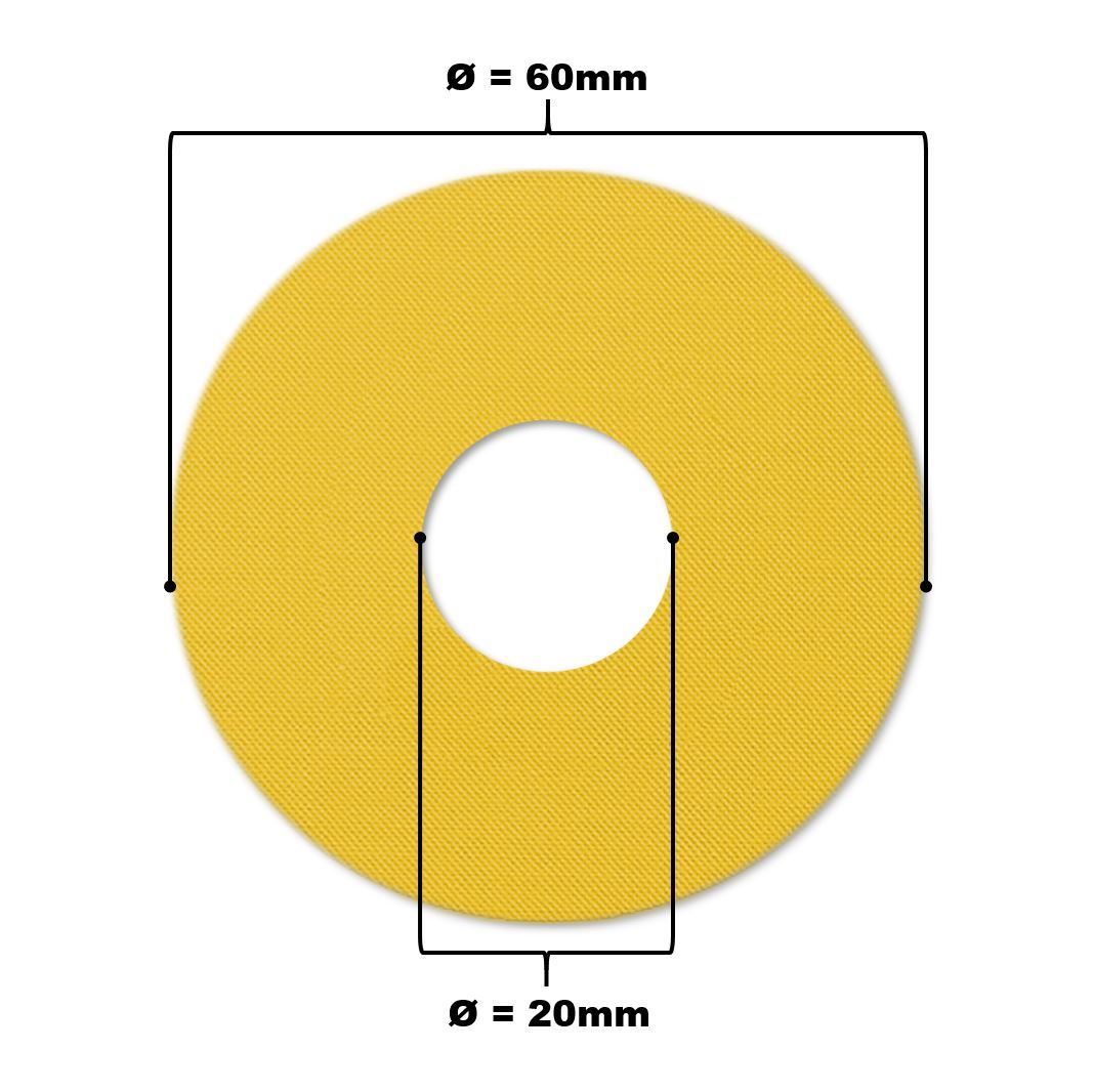 Gelbes Katheterpflaster mit zentralem Loch. Durchmesser 60mm, Lochdurchmesser 20mm. Beschriftung mit Maßangaben.