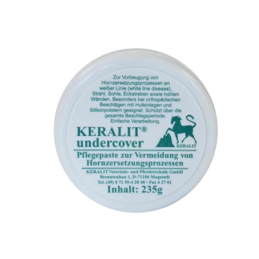 Runde Dose mit weißem Deckel. Aufschrift: KERALIT undercover Pflegepaste. Text in Grün und Schwarz. Inhalt: 235g.
