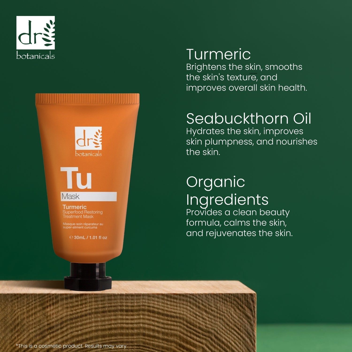 Orange Tube auf Holzblock. Text: Turmeric, Seabuckthorn Oil, Organic Ingredients. Marke: Dr Botanicals. Hintergrund: Grün.