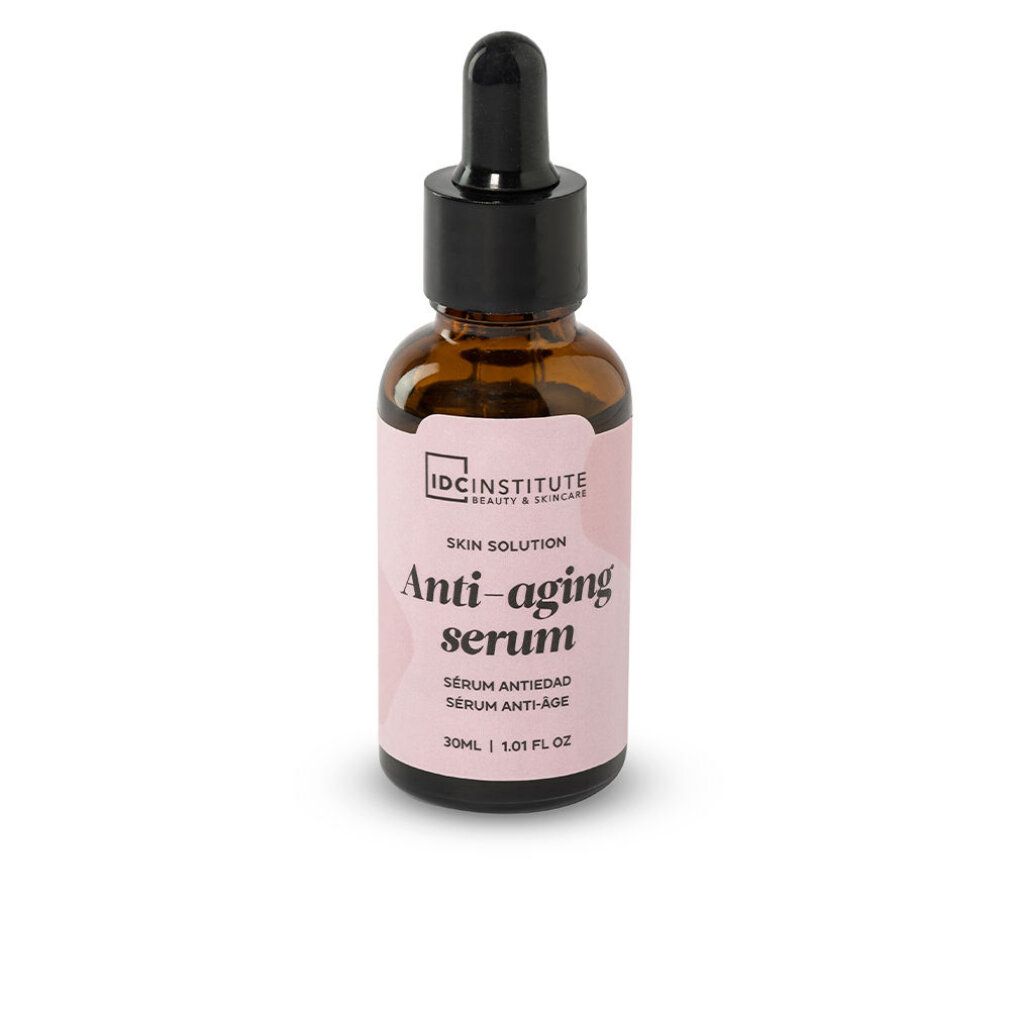 Braune Glasflasche mit schwarzem Tropfer. Rosa Etikett mit Text: Anti-aging serum. Marke: IDC INSTITUTE.