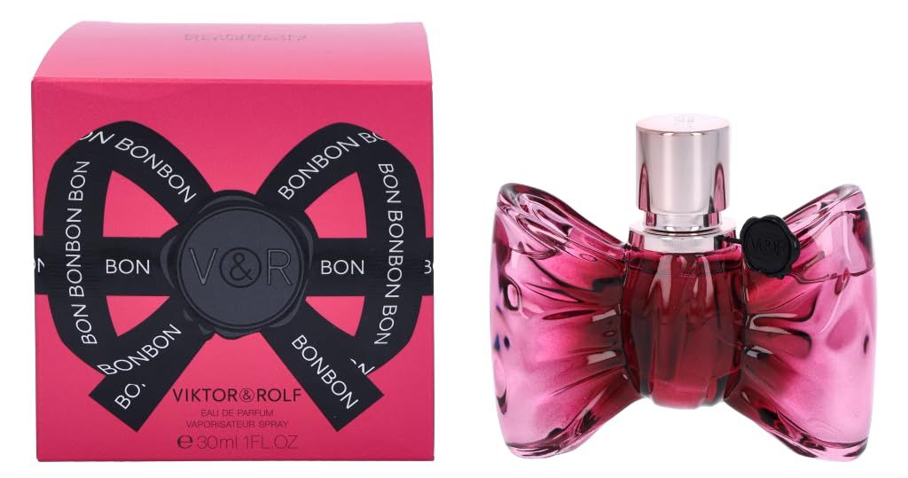 Rosa Schachtel mit schwarzer Schleife und Schriftzug BONBON. Daneben eine rosa Flasche in Schleifenform mit silbernem Verschluss.