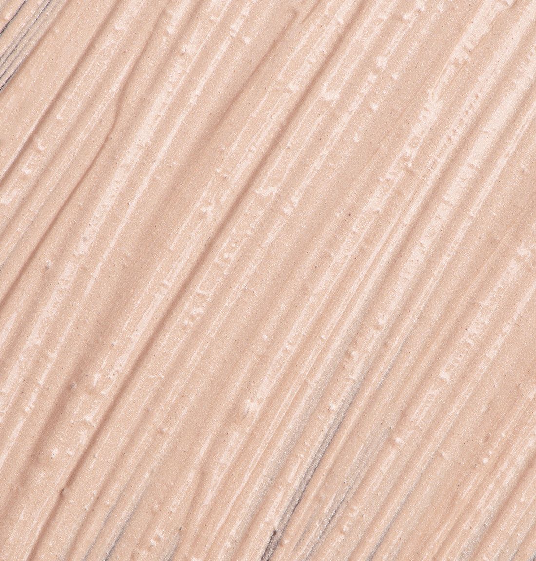 Nahaufnahme von BB Primer-Textur. Creme-Farbe, diagonal gestreift.