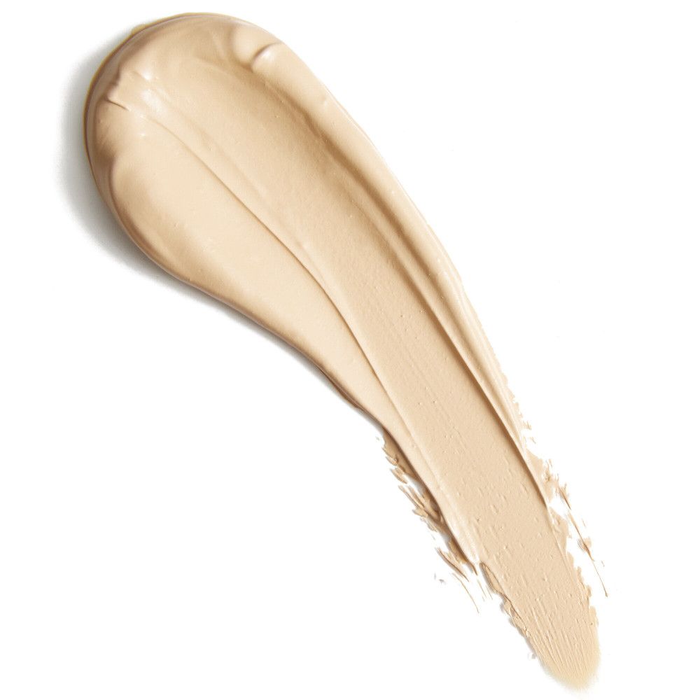 Heller Concealer-Farbton auf weißem Hintergrund. Die Textur ist cremig und in einem diagonalen Strich aufgetragen.