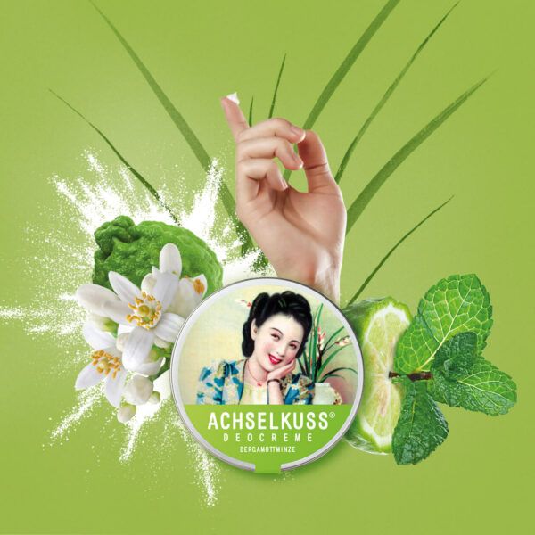 ACHSELKUSS Deocreme Bergamottminze Dose mit Bergamotte, Minze und einer Hand.