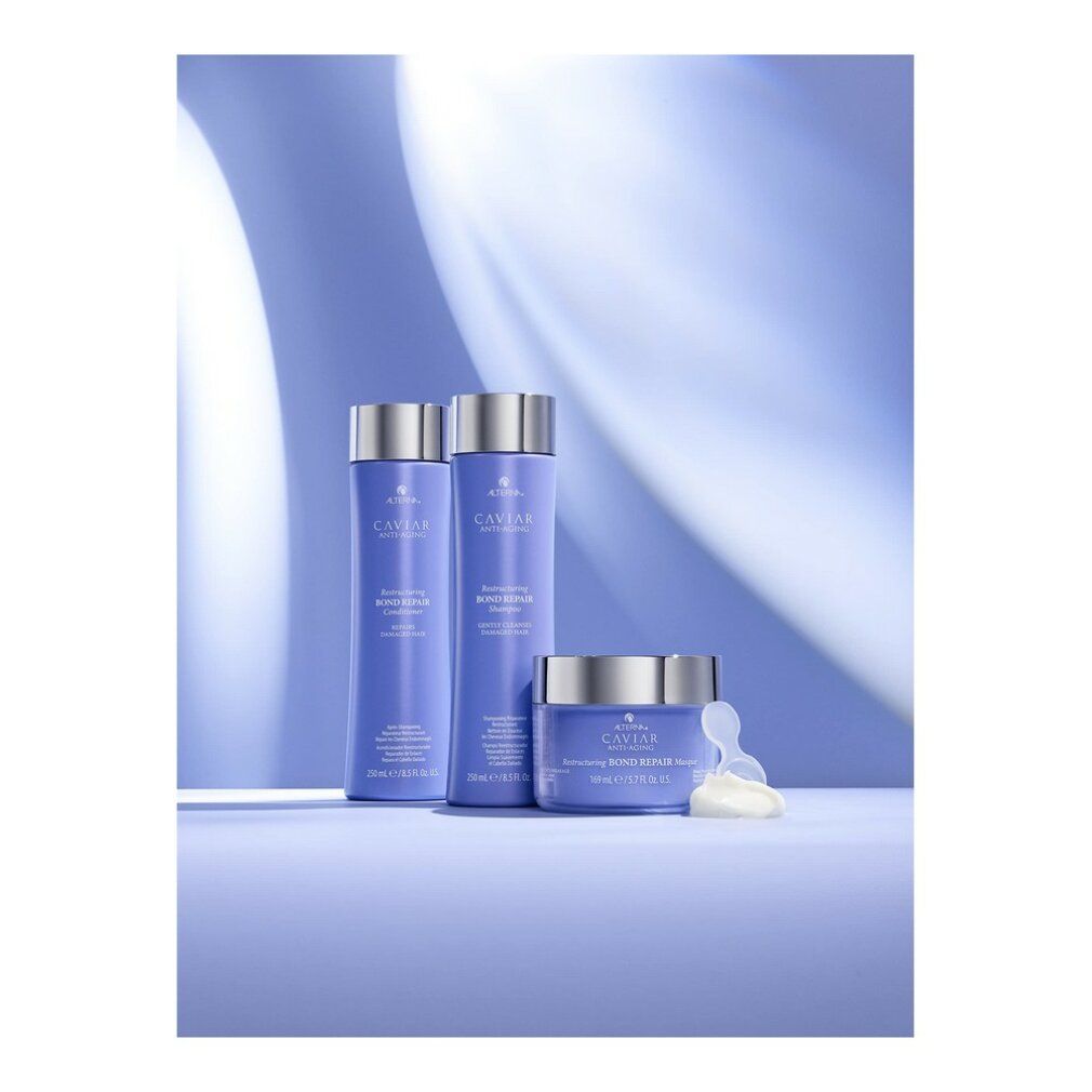 Drei Produkte: Flaschen und Tiegel. Lila Verpackung, silberne Deckel. Aufschrift: Alterna Caviar Anti-Aging, Restructuring Bond Repair.