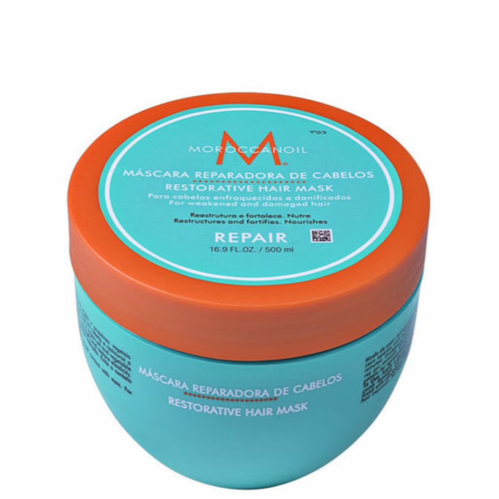 Türkisfarbene Dose mit orangefarbenem Deckel. Text: Moroccanoil, Haarmaske, Repair. 16.9 fl.oz/500 ml.