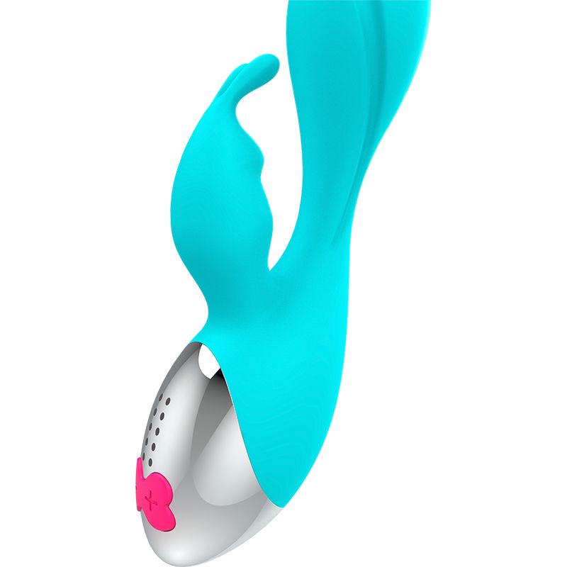 Türkisfarbener Vibrator mit silbernem Kopf und pinkfarbenen Bedienelementen. Hat eine Hasenohren-Form.