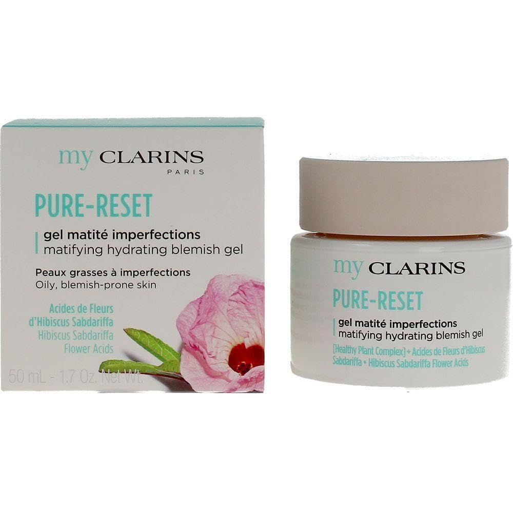 Creme-Tiegel und Schachtel. Aufschrift: my CLARINS PURE-RESET, gel matité imperfections, matifying hydrating blemish gel. Mit Blume.