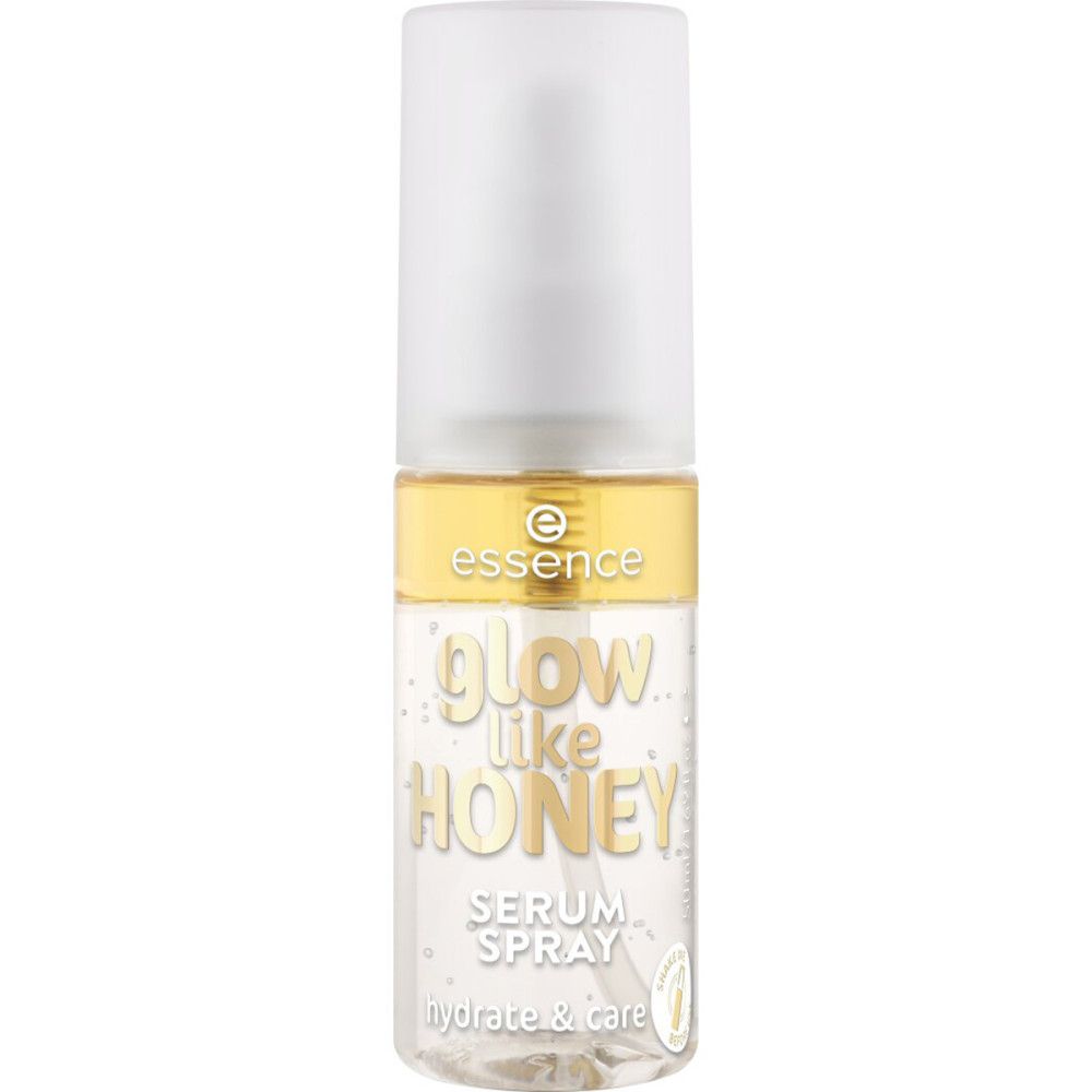 Essence Sérum Spray Glow Like Honey. Transparente Flasche mit weißem Sprühkopf. Goldener Ring mit Markenlogo.