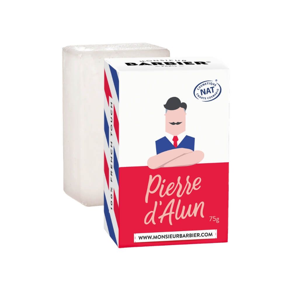 Alaunstein und Verpackung. Verpackung mit rotem, weißem und blauem Design. 'Pierre d'Alun' sichtbar.