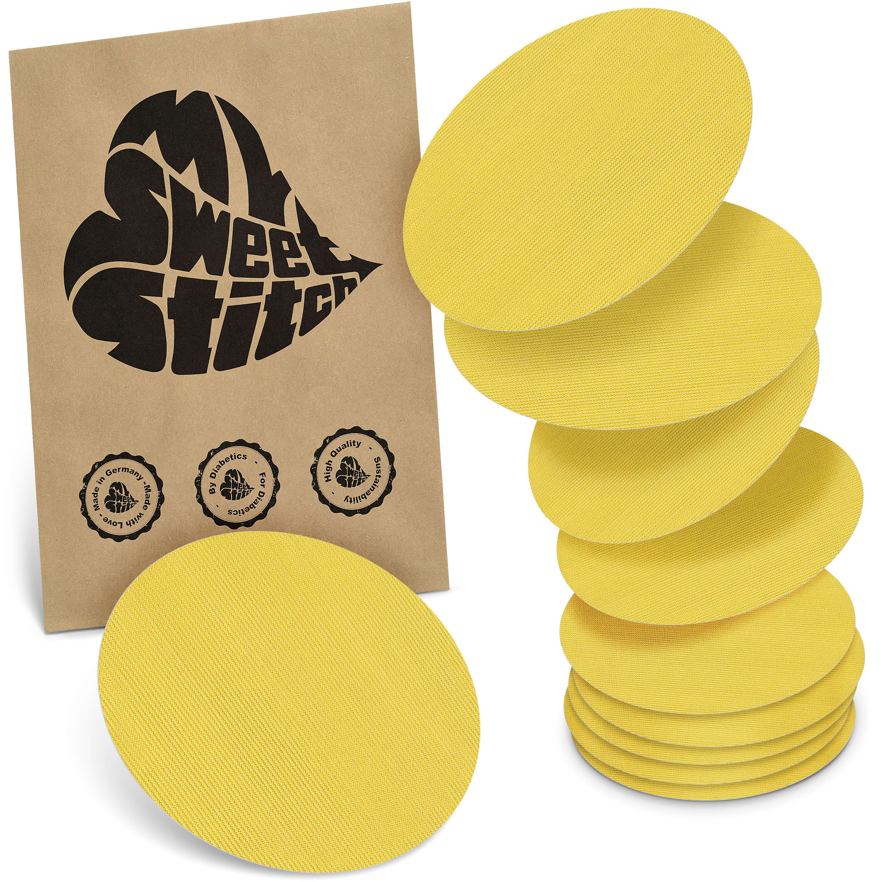 Gelbe, ovale Pflaster. Verpackung mit Logo und Siegeln. Stapel von Pflastern neben der Verpackung.