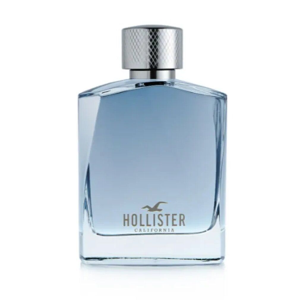 Hollister Wave Eau de Toilette Flakon. Quadratische Form, hellblaue Flüssigkeit. Silberfarbener Verschluss. Logo auf dem Flakon.