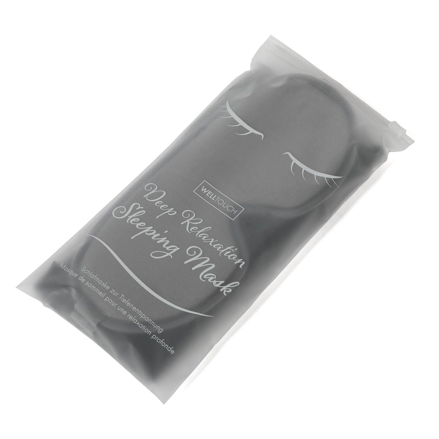 Graue Schlafmaske in transparenter Verpackung mit Aufdruck "Deep Relaxation Sleeping Mask".