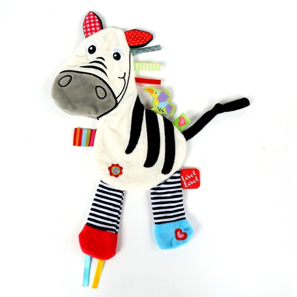Stofftier Zebra mit schwarz-weißen Streifen, bunten Bändern und Label Label-Etikett. Füße mit rot, blau und schwarz-weiß gestreift.