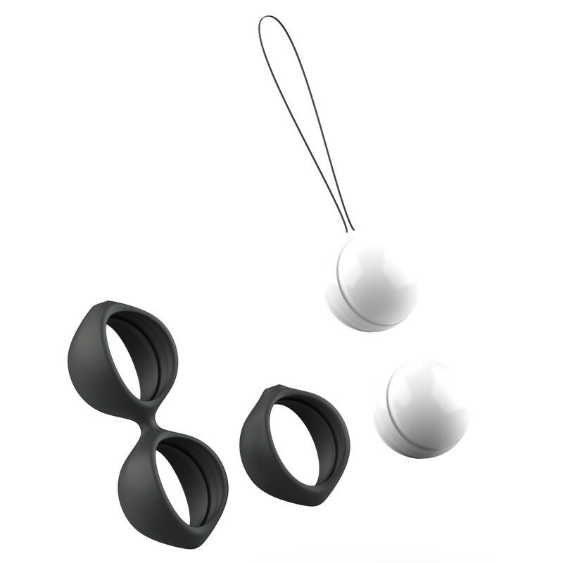 Zwei schwarze Ringe und zwei weiße Kugeln, separat auf weißem Hintergrund arrangiert.