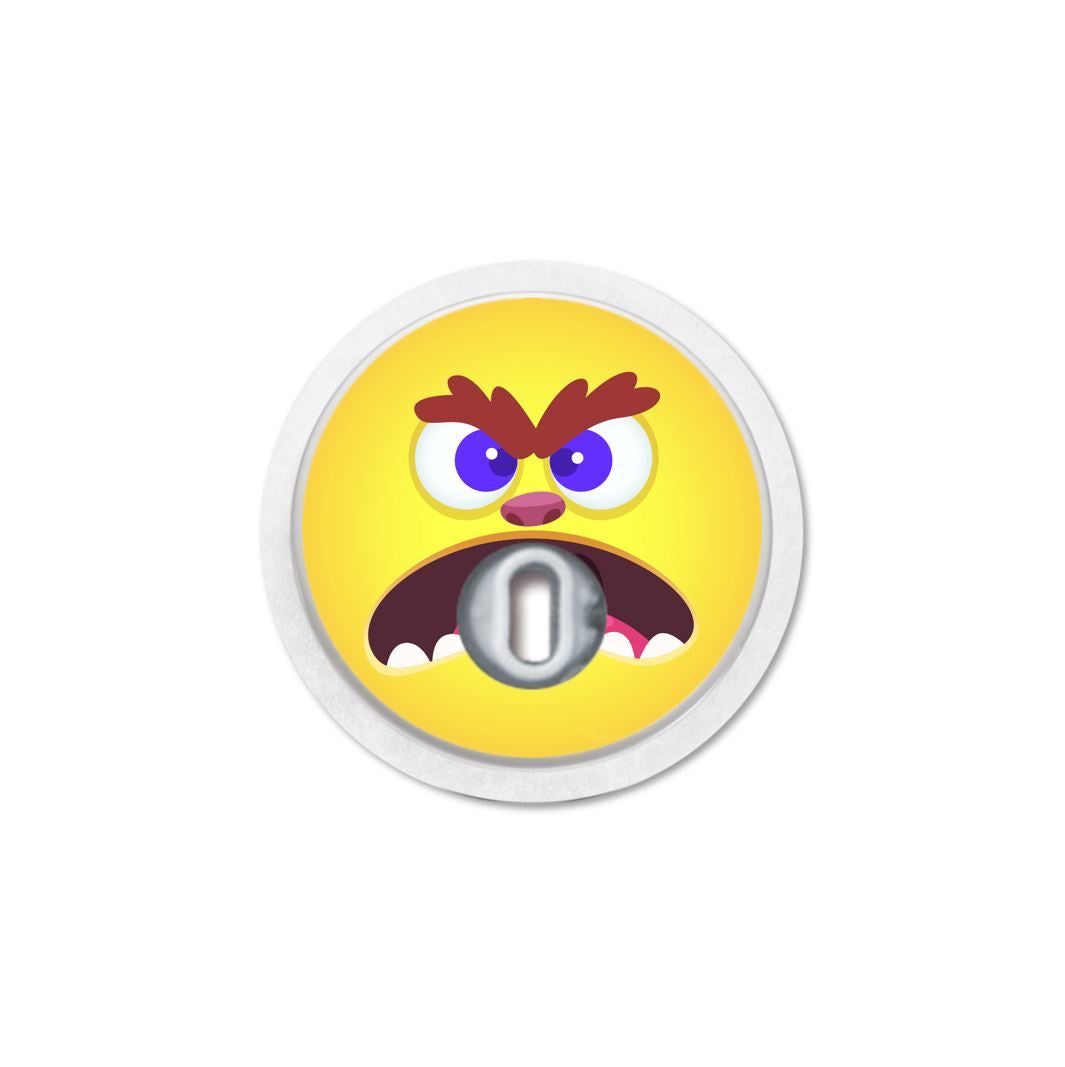 Runder, gelber Aufkleber mit Monstergesicht. In der Mitte eine Öffnung. Weißer Rand.