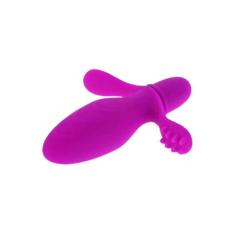 Lila Vibrator mit Flügeln und Noppen. Aus Silikon. Oben abgerundet, unten zylindrisch.