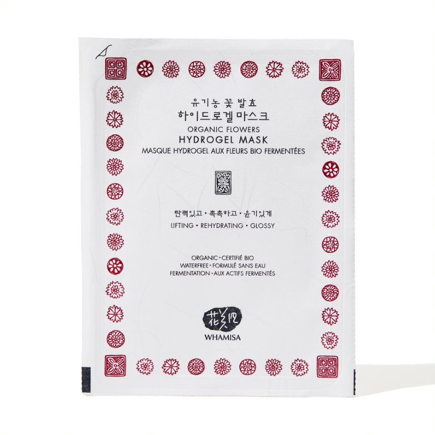 Weiße Verpackung mit rotem floralen Muster. Text: Organic Flowers Hydrogel Mask. Marke: WHAMISA.
