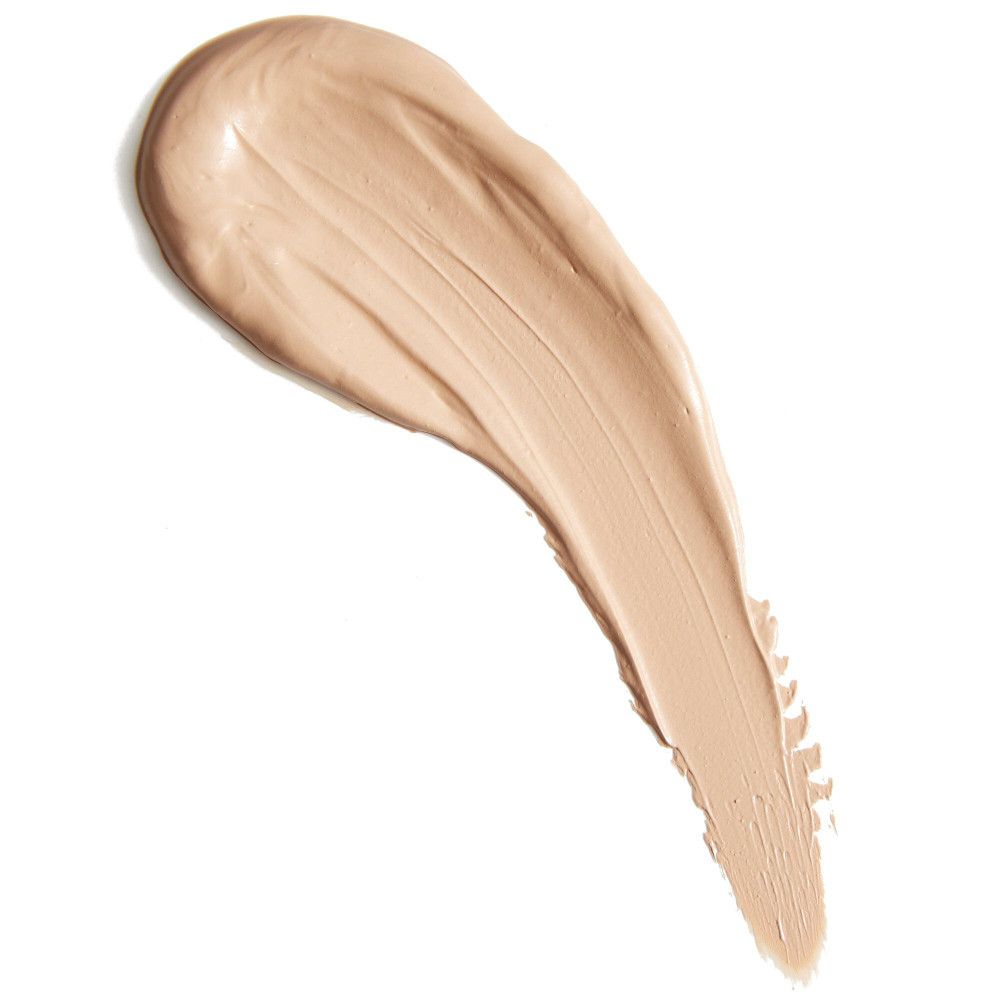 Heller Concealer-Strich auf weißem Hintergrund. Cremige Textur, Farbton hell.