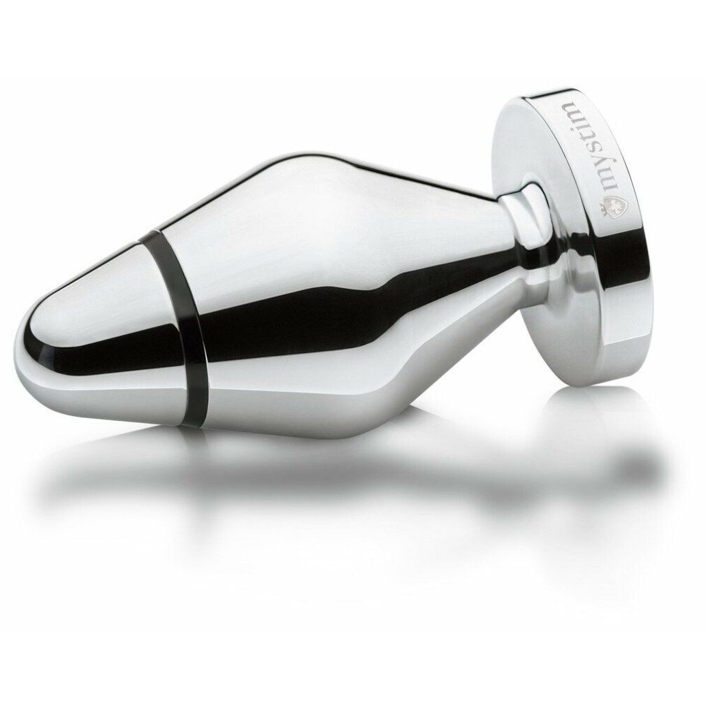 Silberfarbener Buttplug. Tropfenförmig mit schwarzem Ring. Basis mit Marke Mystim. Liegend dargestellt.