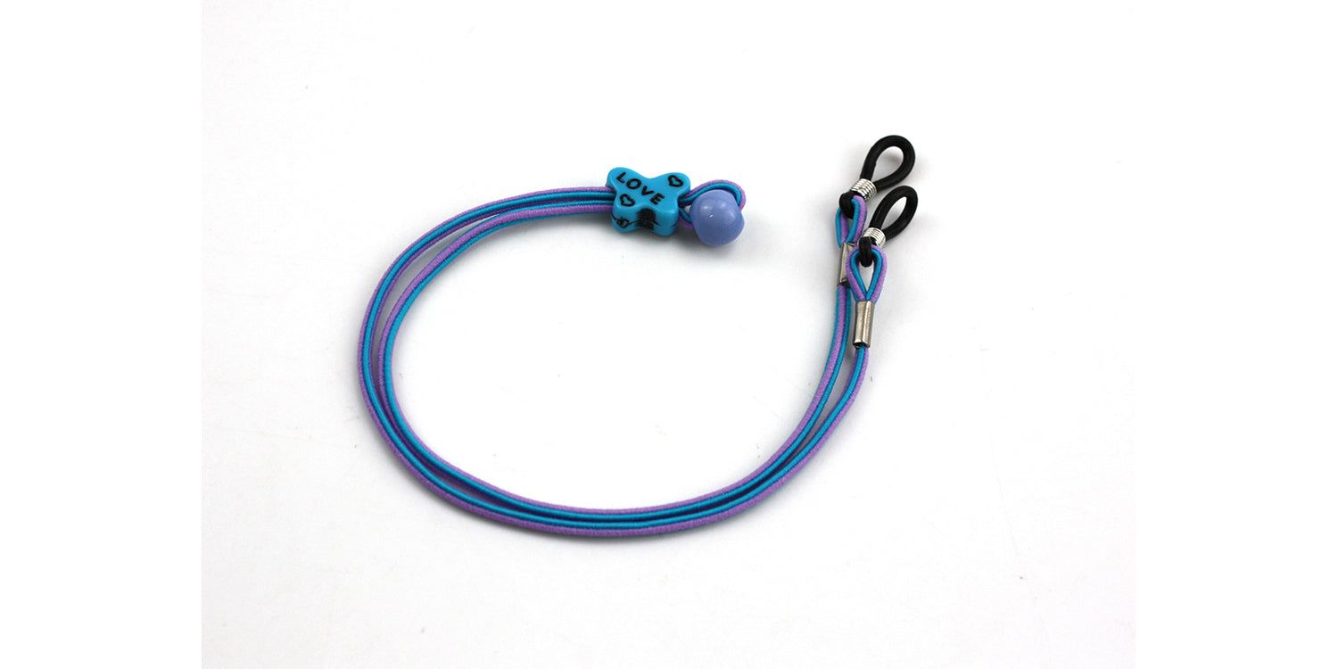 Brillenband, blau-violett, mit blauem Teddy-Dekor und Kordelenden. Für Kinderbrillen.