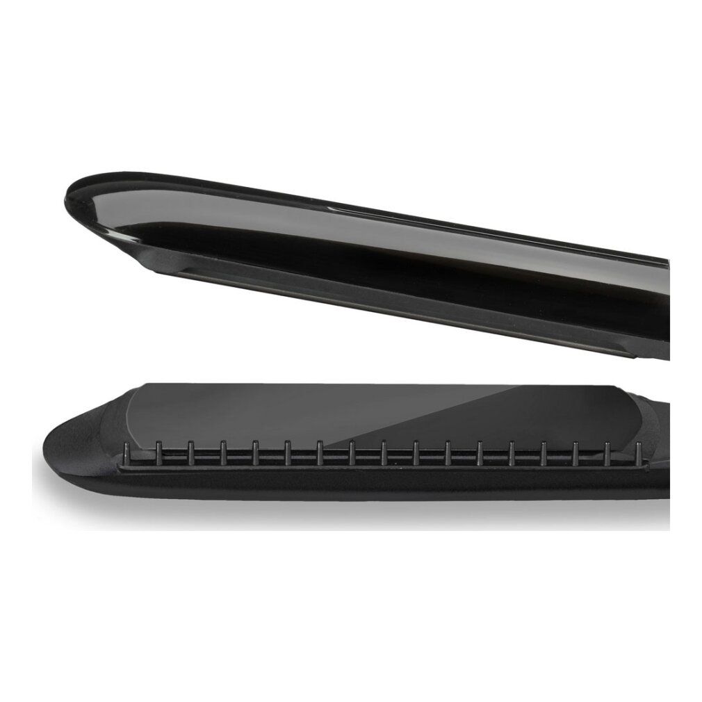 Nahaufnahme der Haarglätterplatten. Schwarze, glänzende Oberfläche.