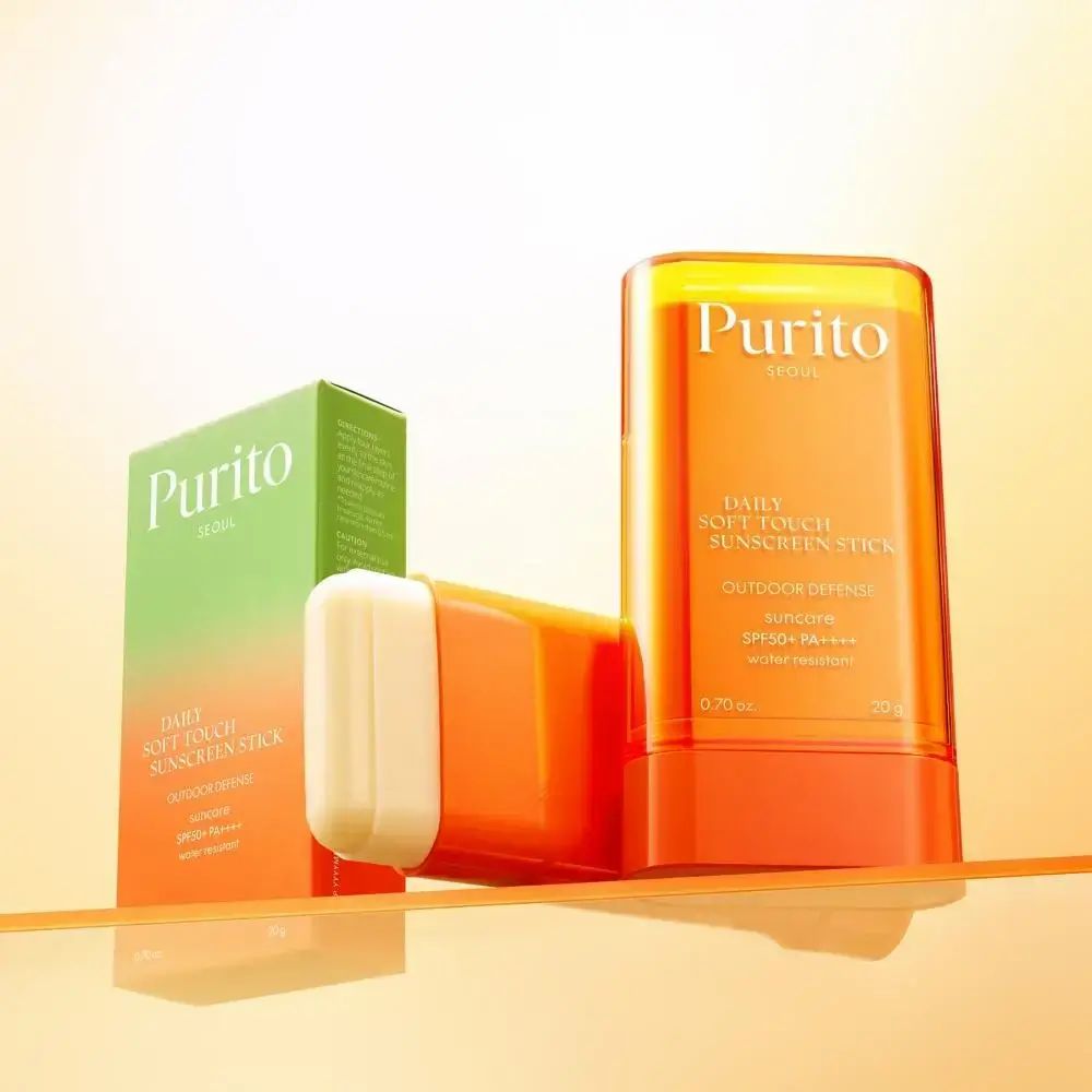 Sonnenschutz-Stick, Verpackung und Stick. Text: Purito, Daily Soft Touch Sunscreen Stick, SPF50+ PA++++, 0.70 oz, 20 g.