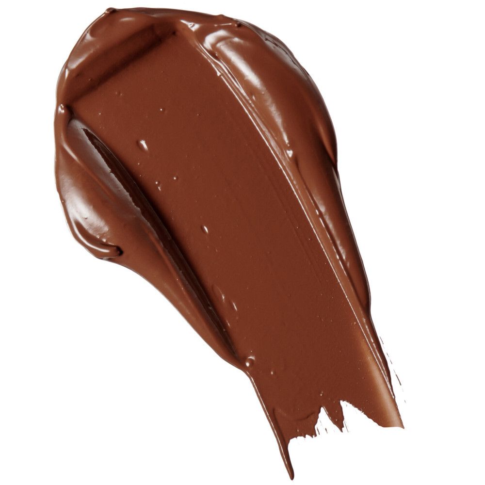 Brauner Concealer-Abstrich. Farbton-Test auf weißem Hintergrund.