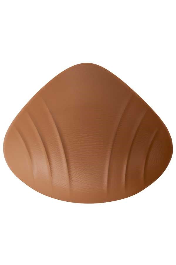 Ausgleichsprothese in Hautfarbe. Tropfenförmig mit geriffelter Rückseite.