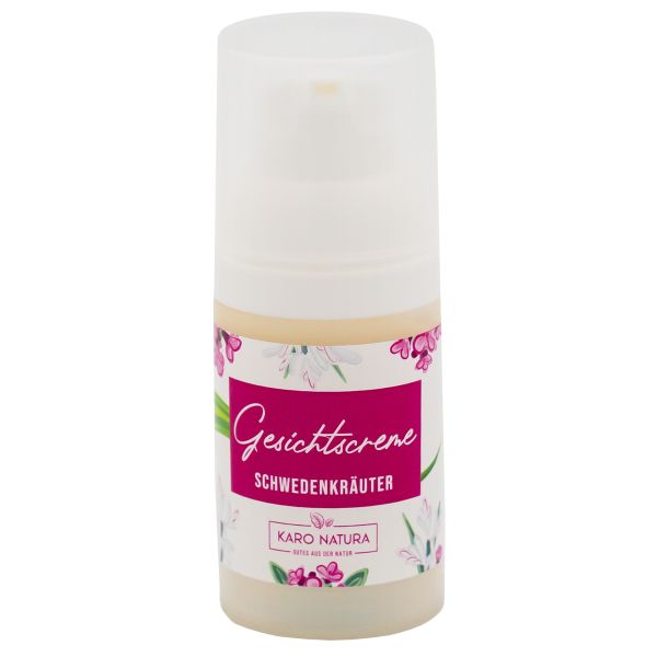 Gesichtscreme-Spender mit floralem Design und Text. Aufschrift: Gesichtscreme, Schwedenkräuter, Karo Natura.