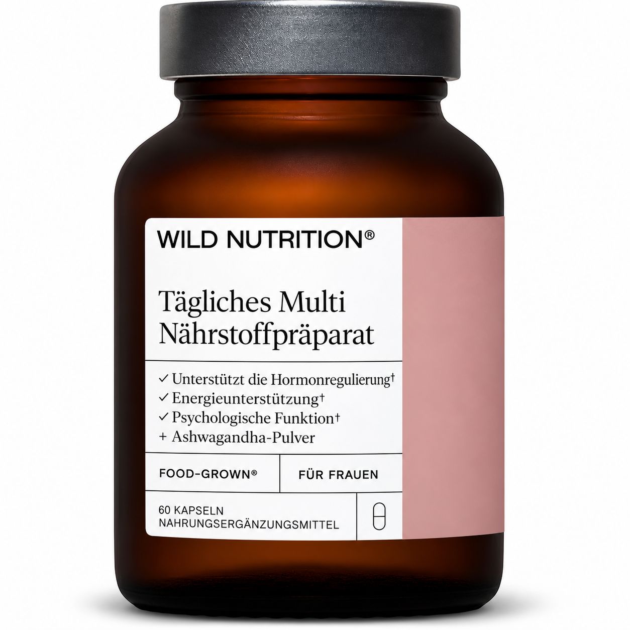 Wild Nutrition Daily Multi Nutrient Flasche in Händen mit Orangenscheiben.