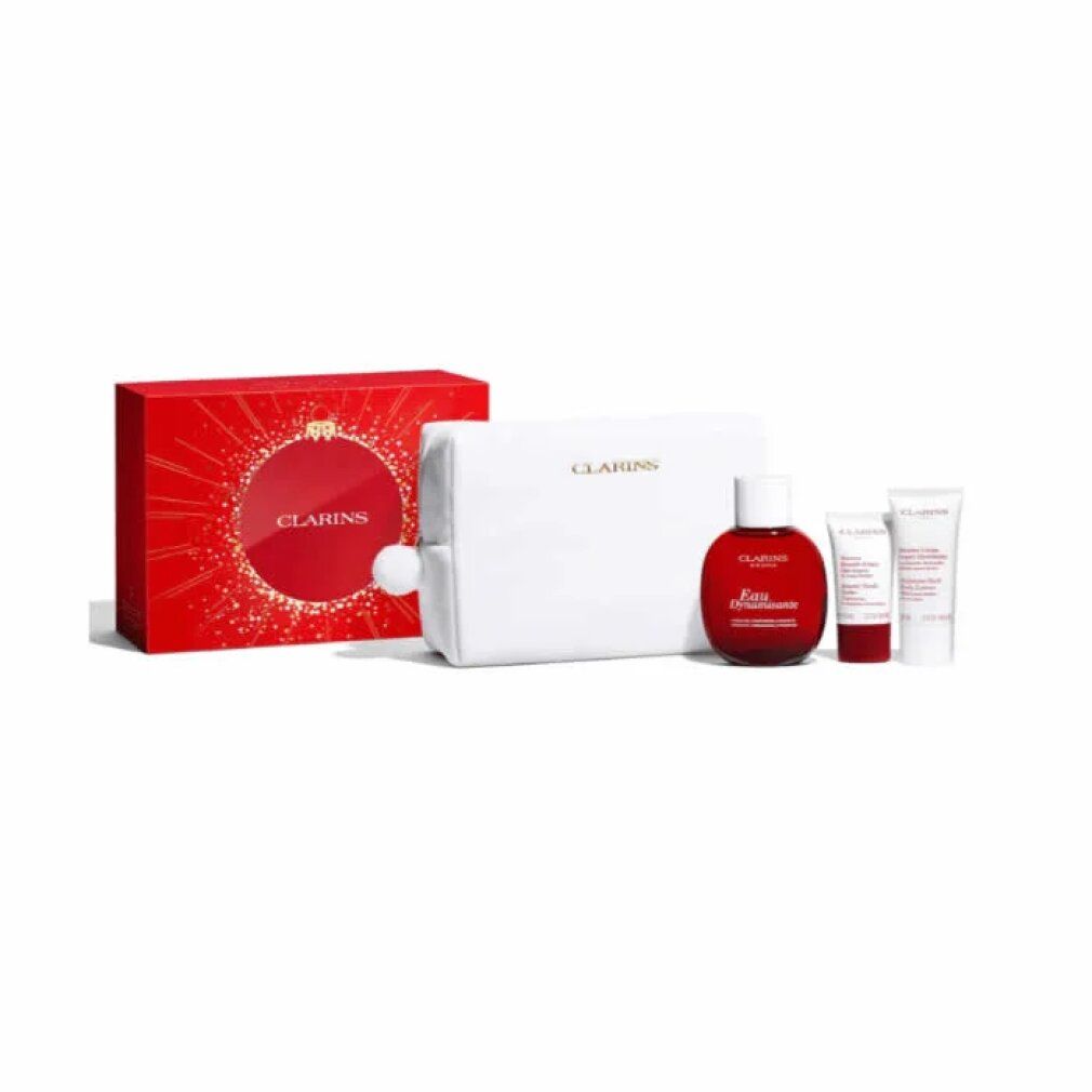 Geschenkset mit roter Box, weißer Kosmetiktasche und drei weiteren Produkten. Clarins-Logo sichtbar.