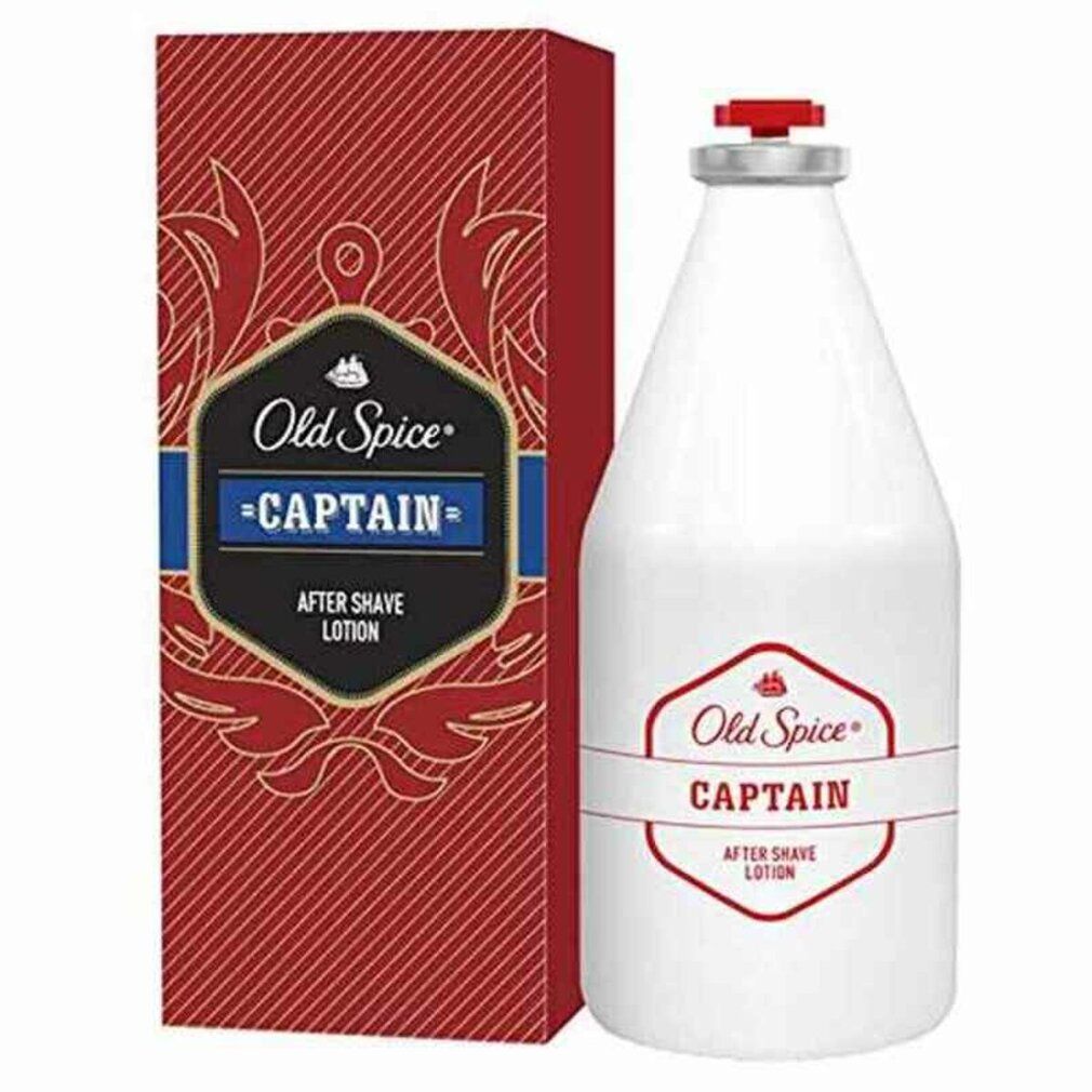 Weiße Flasche und rote Verpackung. Aufschrift: Old Spice Captain After Shave. Rote und blaue Akzente.