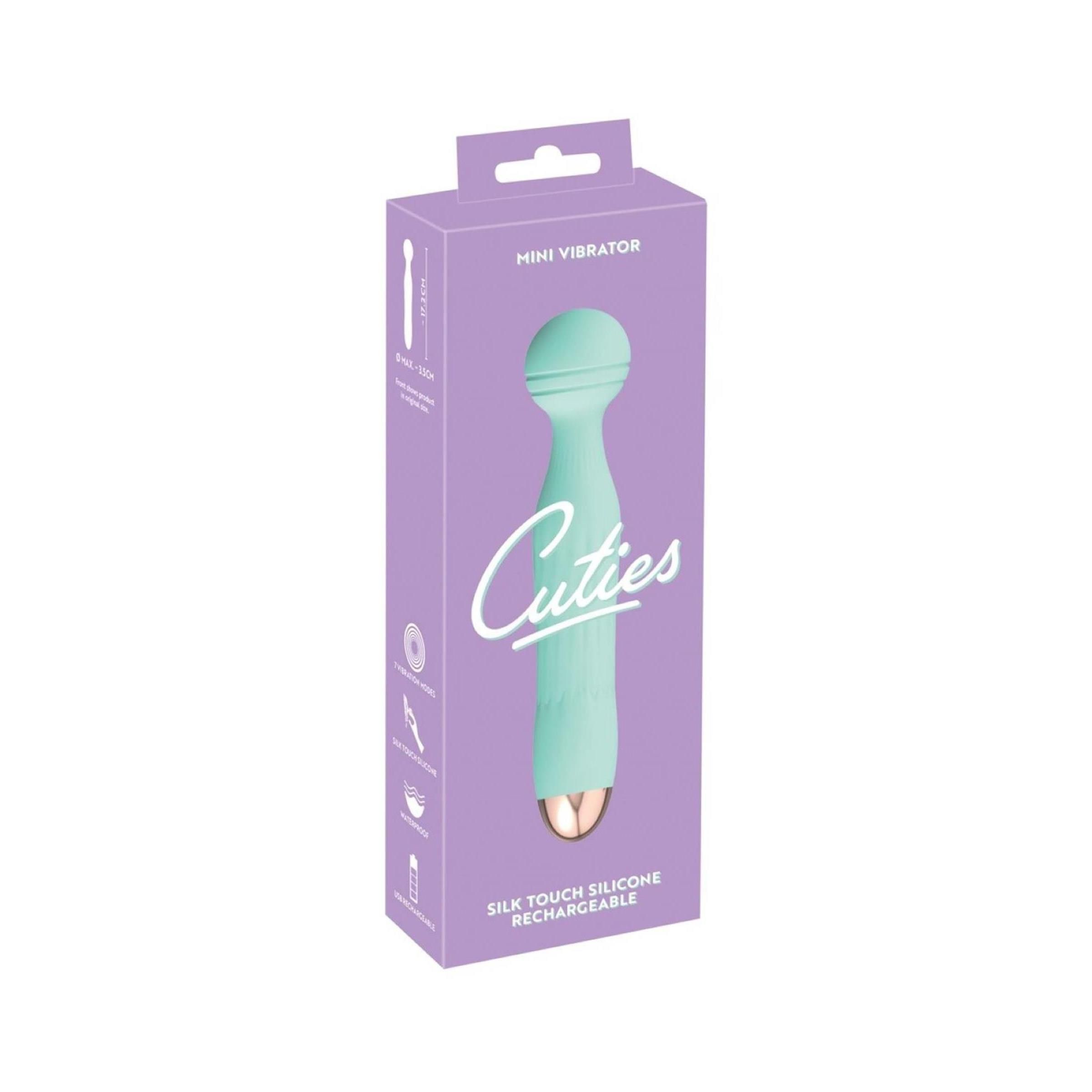 Minivibrator in Verpackung. Türkisgrün, goldfarbene Spitze, Schriftzug Cuties. Aufschrift: Mini Vibrator, Silk Touch Silicone, Rechargeable.