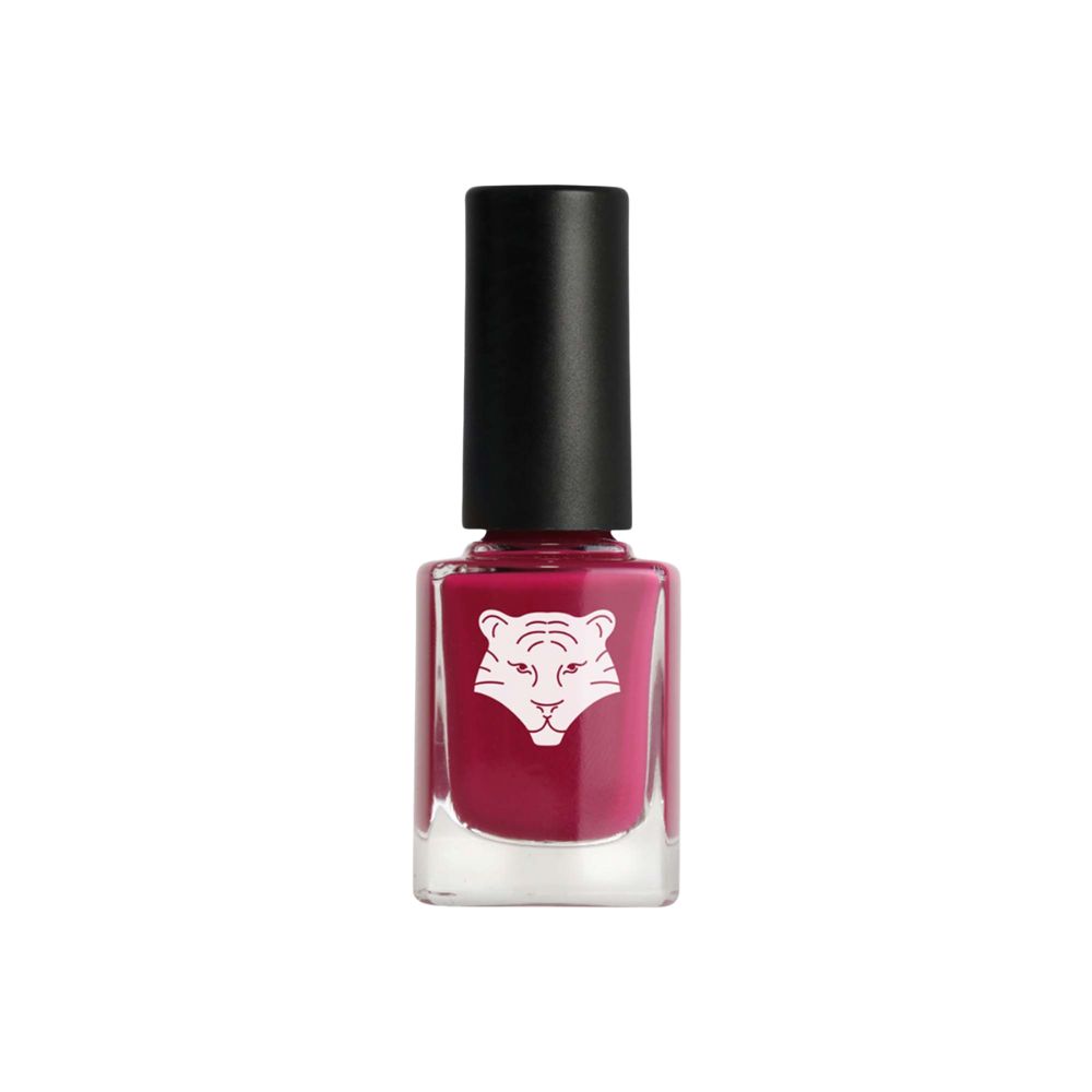 Nagellackflasche mit schwarzem Deckel. Quadratische Glasflasche mit pinkfarbenem Lack. Weißes Tigerlogo auf der Vorderseite.