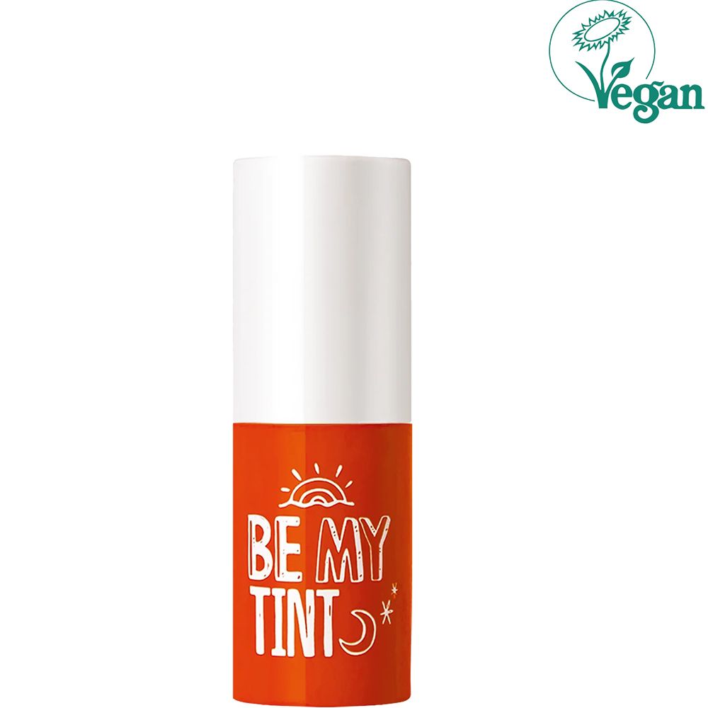 Lippentönung mit weißem Deckel und orangefarbenem Körper. Aufschrift: BE MY TINT. Vegan-Siegel.