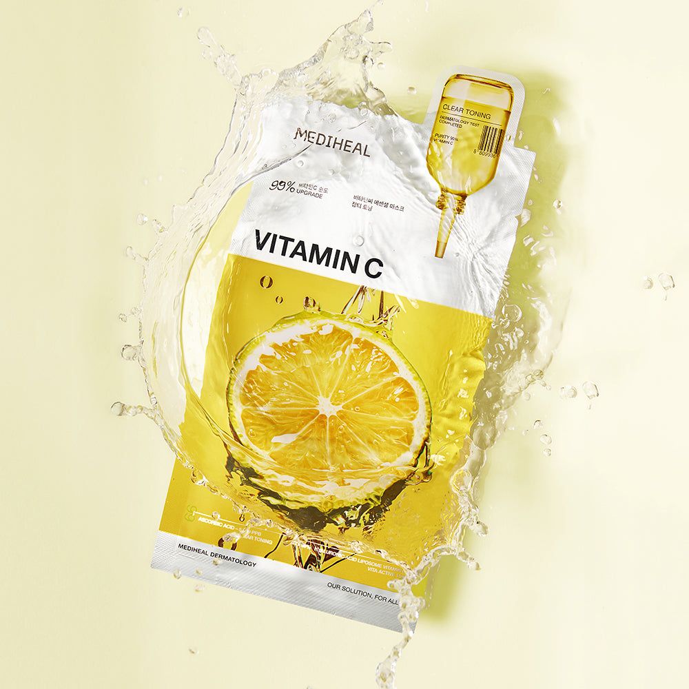 Verpackung der MEDIHEAL Vitamin C Tuchmaske mit Zitrone und Wasser. Gelbe Verpackung mit Dosierampulle.