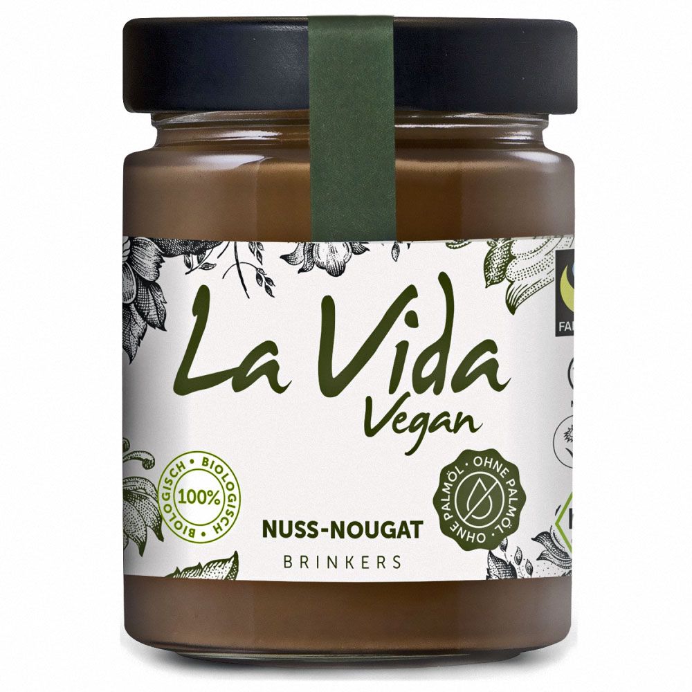 Glas mit Nuss-Nougat-Creme. Aufschrift: La Vida Vegan, Nuss-Nougat, ohne Palmöl. Grün-weißes Etikett mit floralen Elementen.