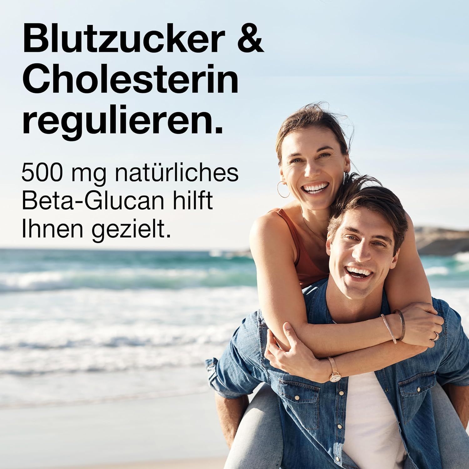 Ein Mann trägt eine Frau am Strand. Text: 'Blutzucker & Cholesterin regulieren.' und '500 mg natürliches Beta-Glucan hilft Ihnen gezielt'.