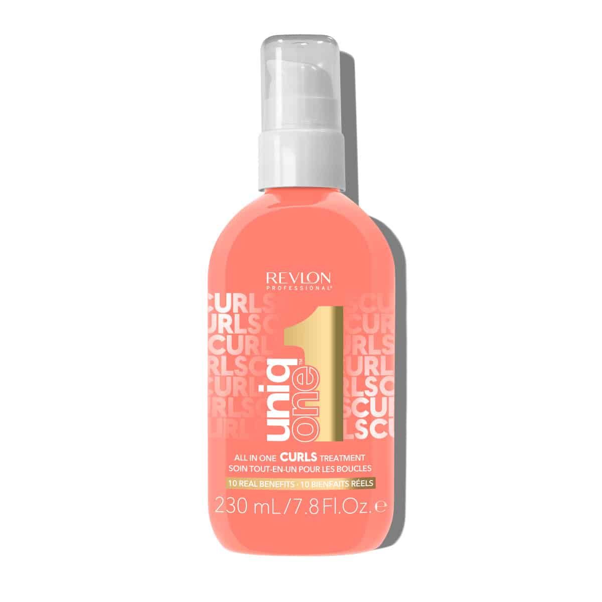 Runde, rosa Flasche mit Sprühkopf. Aufschrift: UniqOne Curls, Revlon. 230 ml.