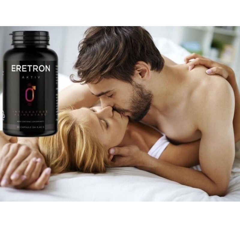 Paar küsst sich im Bett. Daneben eine Flasche "Eretron Aktiv". Schwarze Flasche mit männlichem Symbol. "Integratore Alimentare".