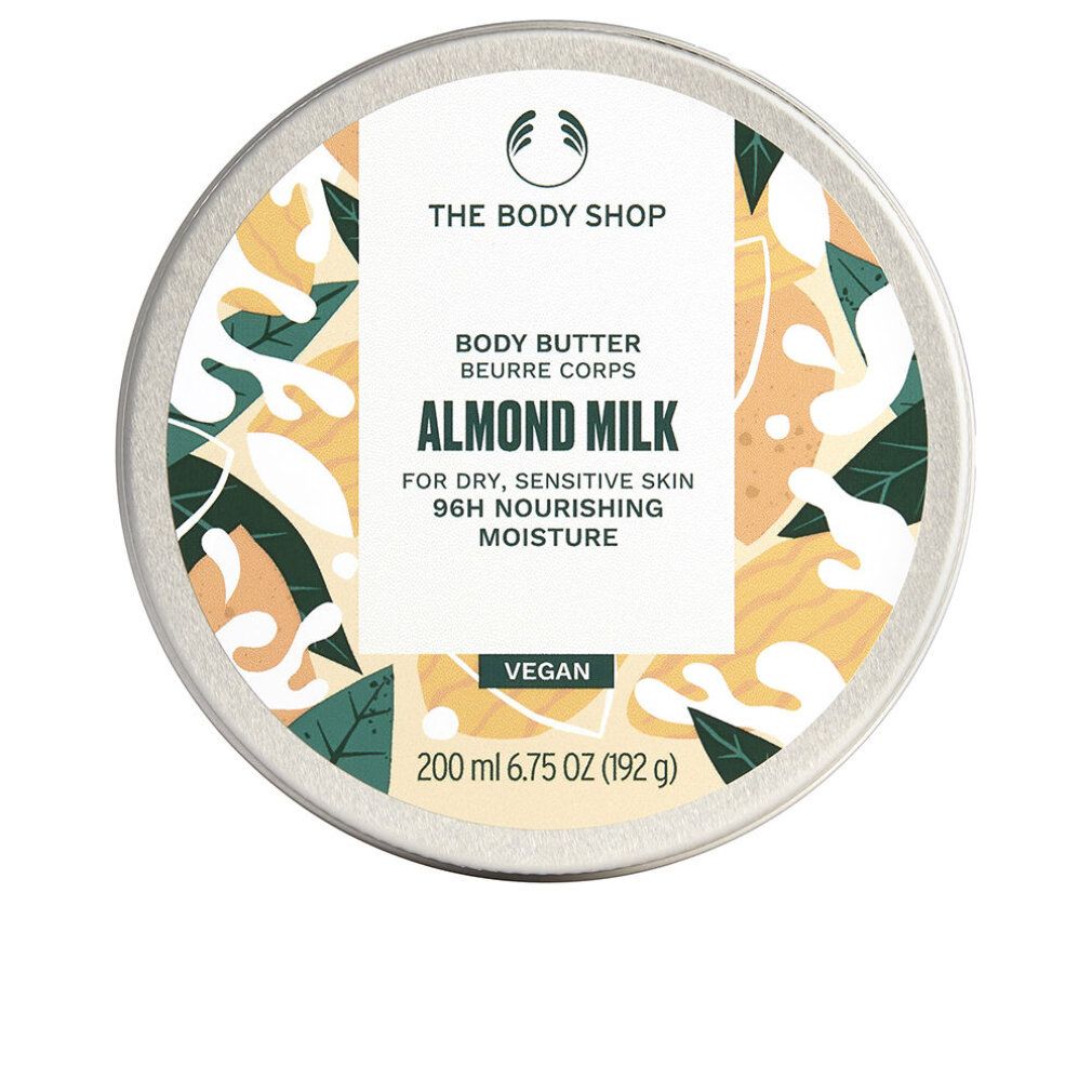 Runde Dose mit Deckel. Aufschrift: The Body Shop, Body Butter Almond Milk. Für trockene, empfindliche Haut. Vegan. 200 ml.