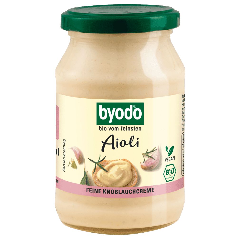 Bio Aioli in einem Glas mit grünem Deckel. Etikett zeigt "byodo", "Aioli", "Feine Knoblauchcreme", "Vegan" und "Bio".
