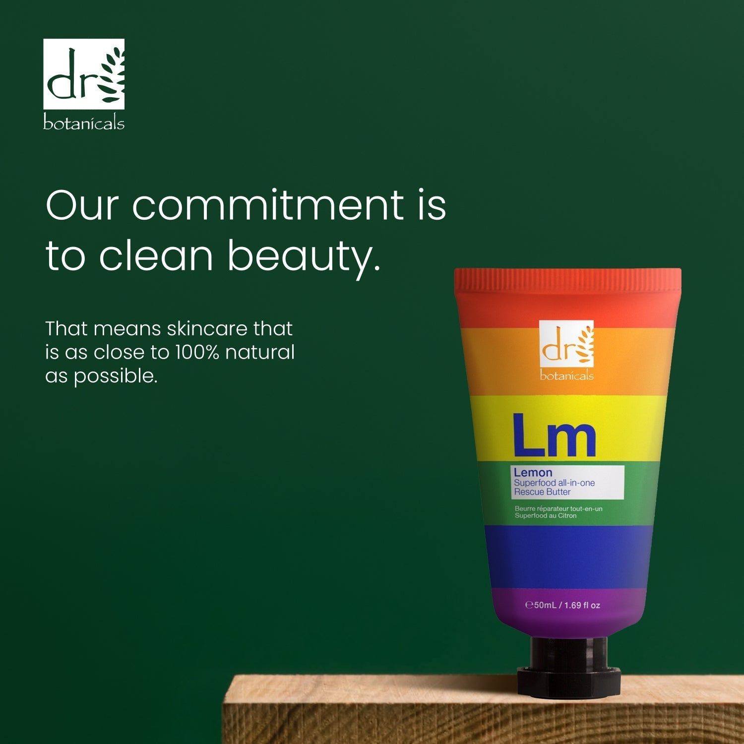 Tube mit Regenbogenfarben. Text: Dr Botanicals, Lm, Lemon Superfood All-in-one Rescue Butter. Text: Our commitment is to clean beauty.