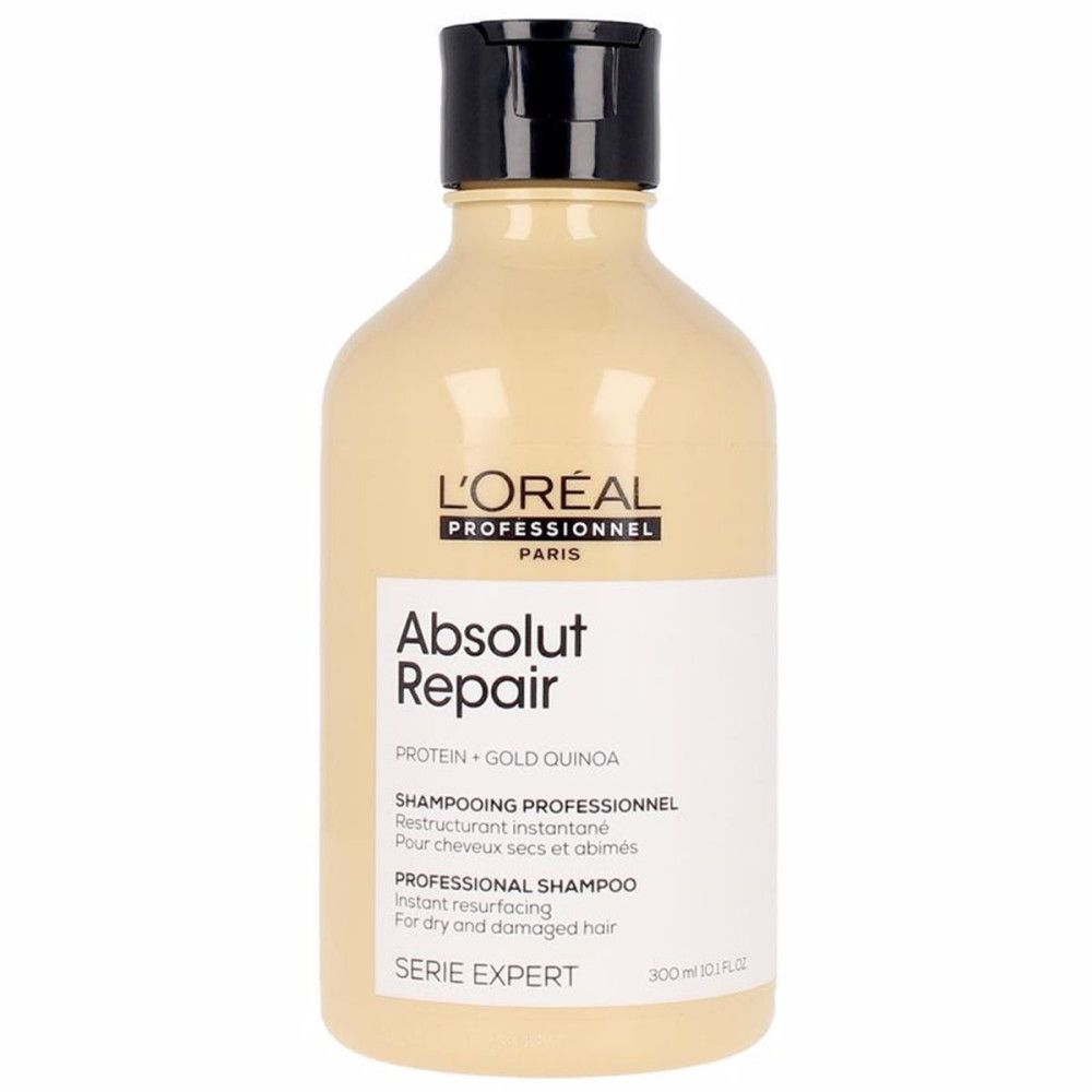 Beige Shampoo-Flasche mit schwarzem Deckel. L'Oréal Professionnel Absolut Repair. Text auf Etikett.