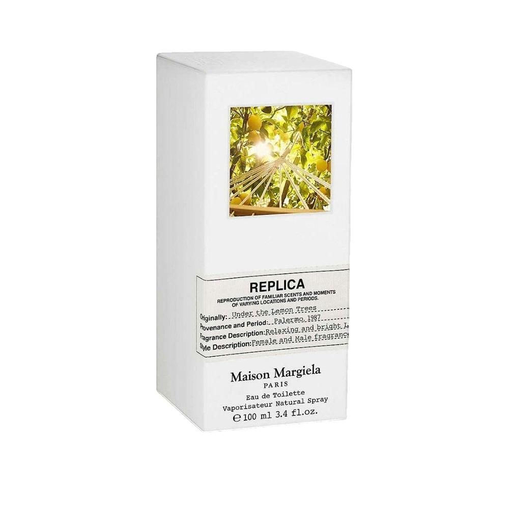 Weiße rechteckige Verpackung mit Bild von Zitronenbäumen. Aufschrift: Replica, Maison Margiela Paris.